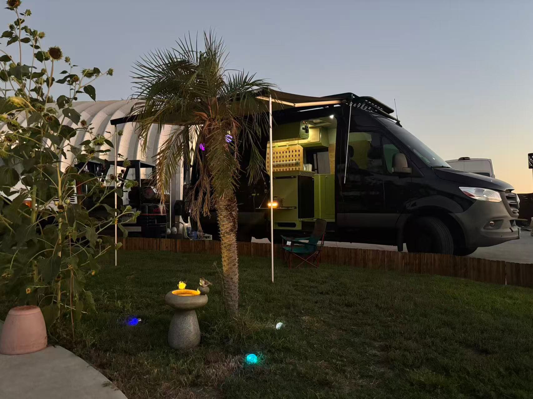 Spring Le Tour van at twilight campsite
